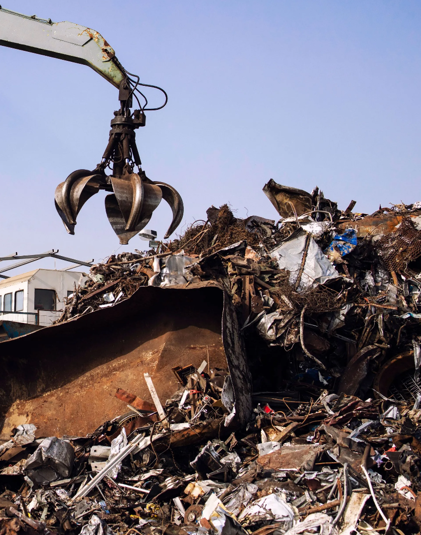 Scrap metal crane lifting steel at Tallahassee yard